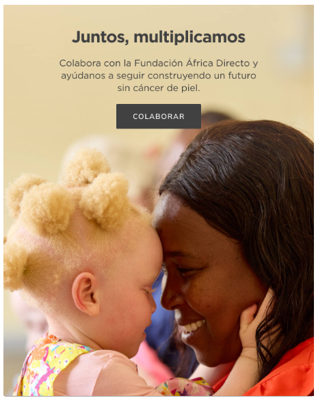 Persona adulta sostiene en brazos a un niño con cabello rubio rizado, ambos en un entorno cálido y luminoso. Texto sobre la imagen: “Juntos, multiplicamos. Colabora con la Fundación África Directo y ayúdanos a seguir construyendo un futuro sin cáncer de piel. Botón: Colaborar”.